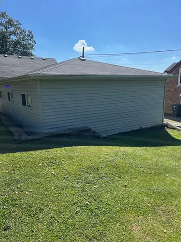 a view of a backyard of the house