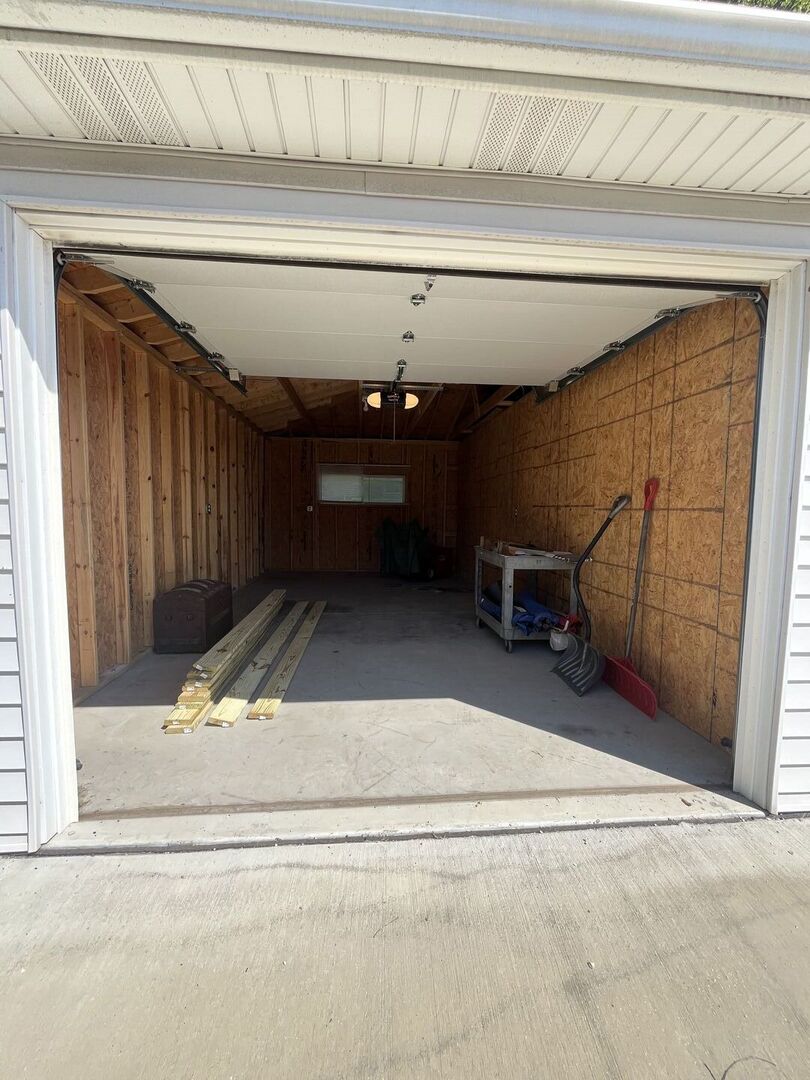 1310 Belleview Avenue Joliet, IL 60436 - Photo 7 of 9 a view of a garage door and wooden floor
