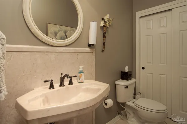 a spacious bathroom with a double vanity sink a mirror and a shower