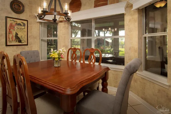 a view of a dining room with furniture and window