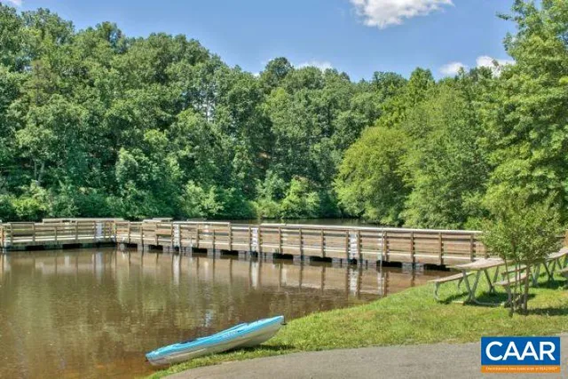 a view of a lake with a house in the background