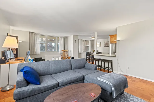 a living room with furniture and a table