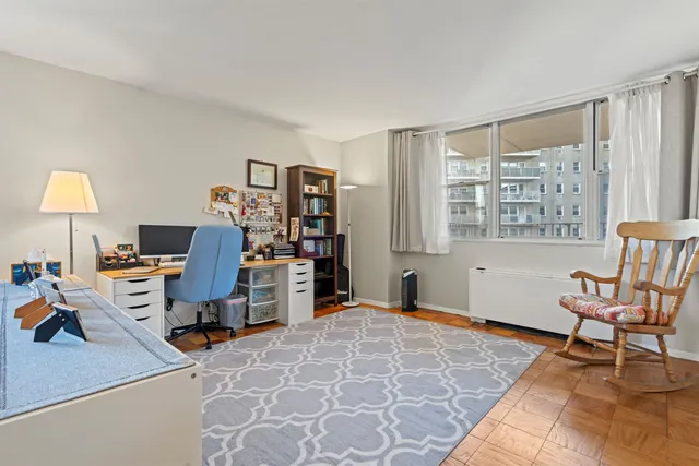 a workspace with furniture and a window