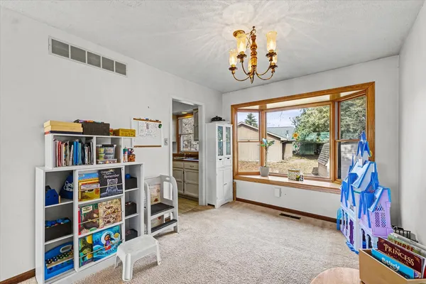 a view of a livingroom with furniture and windows