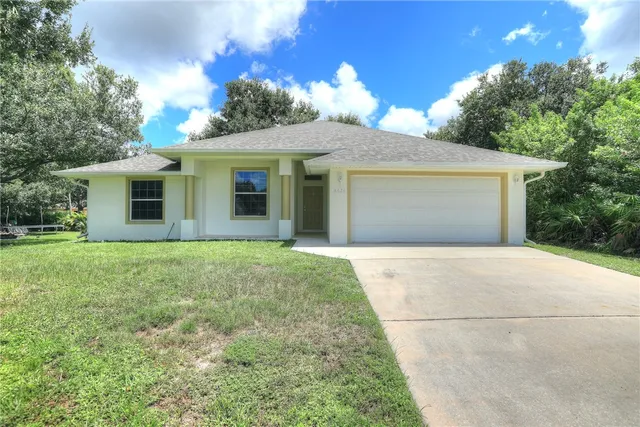 a view of outdoor space yard and garage