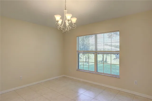 a view of kitchen with center island and cabinets