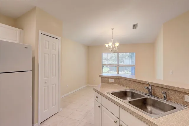 a kitchen with a sink a stove and refrigerator