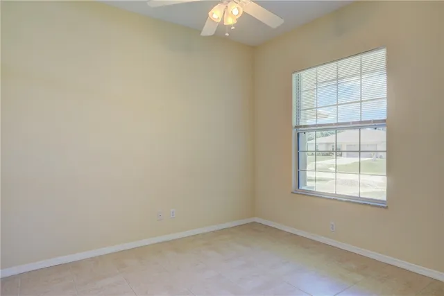 an empty room with a empty space and windows