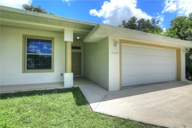 a front view of a house with a garage