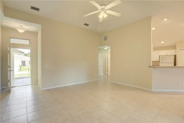 a view of an empty room with a fan