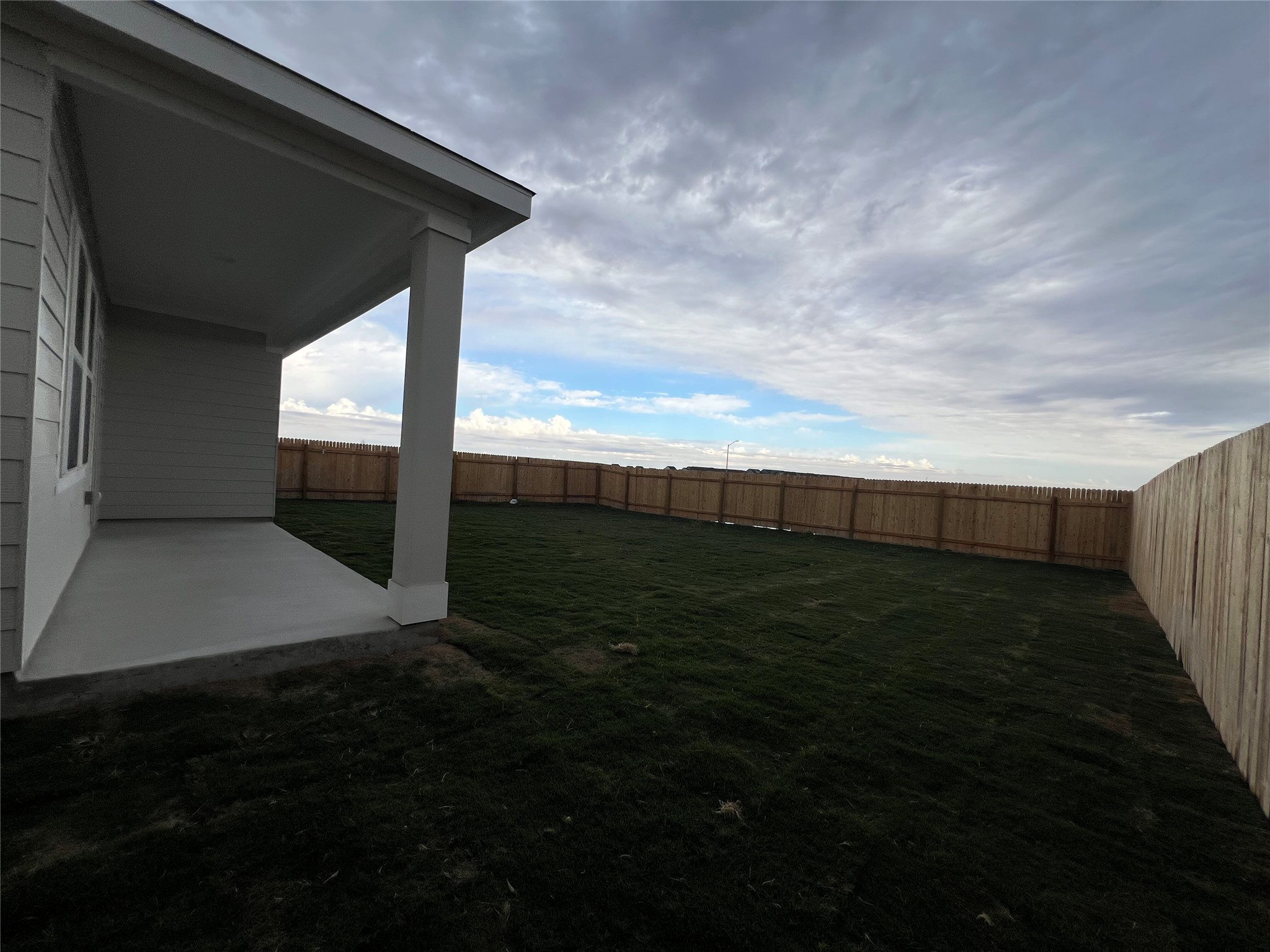 124 Rother Place Taylor, TX 76574 - Photo 11 of 12 A spacious, newly sodded backyard with a private wooden fence, perfect for outdoor enjoyment.