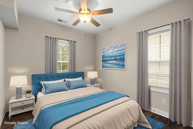 a bedroom with a large bed and a window