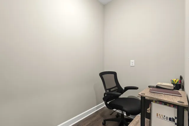 a view of workspace with furniture and a window