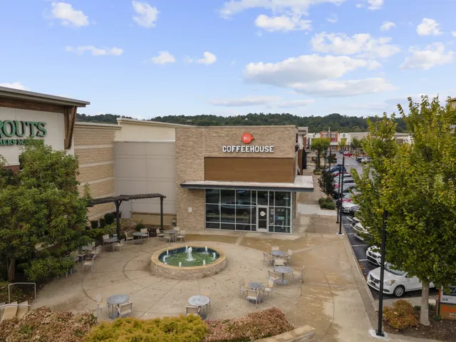 a view of a street with sitting space