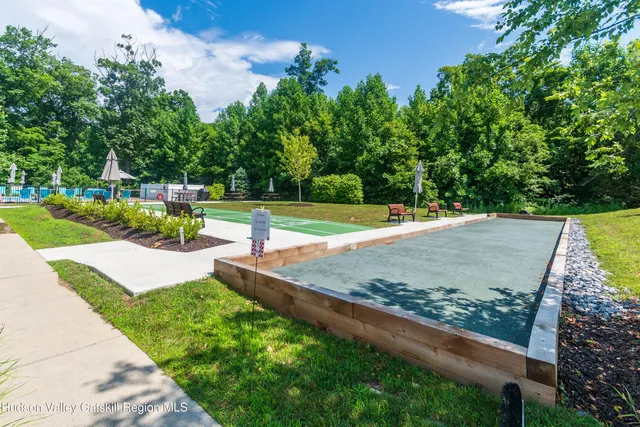 a view of a backyard with a garden and plants