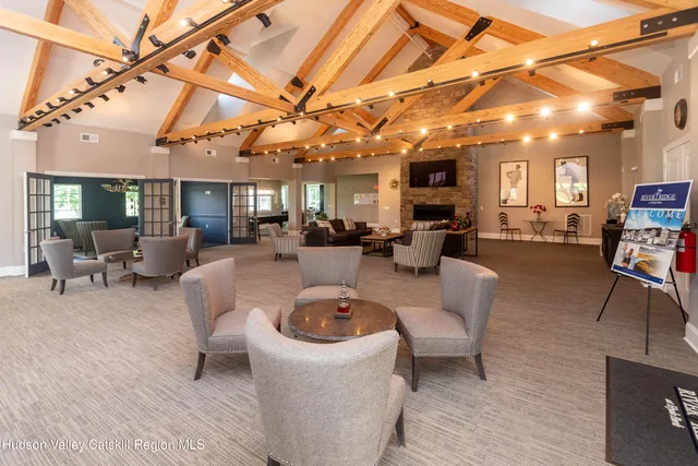 a living room with a fireplace and a fireplace