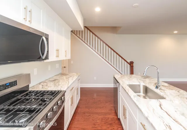 a kitchen with a stove and a sink