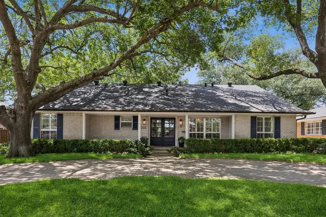 a house view with a garden space