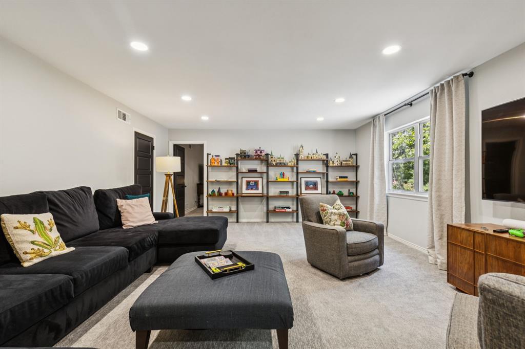 6222 East University Boulevard Dallas, TX 75214 - Photo 17 of 25 a living room with furniture and a flat screen tv
