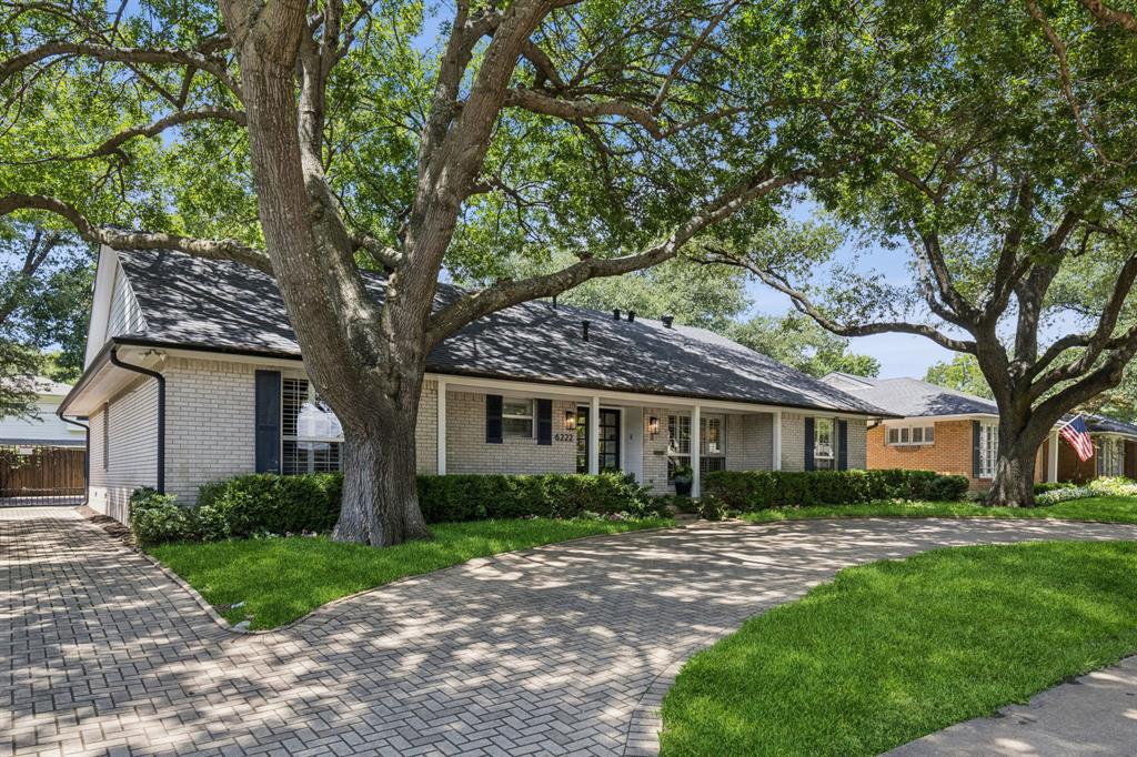 6222 East University Boulevard Dallas, TX 75214 - Photo 2 of 25 a front view of white house with a garden