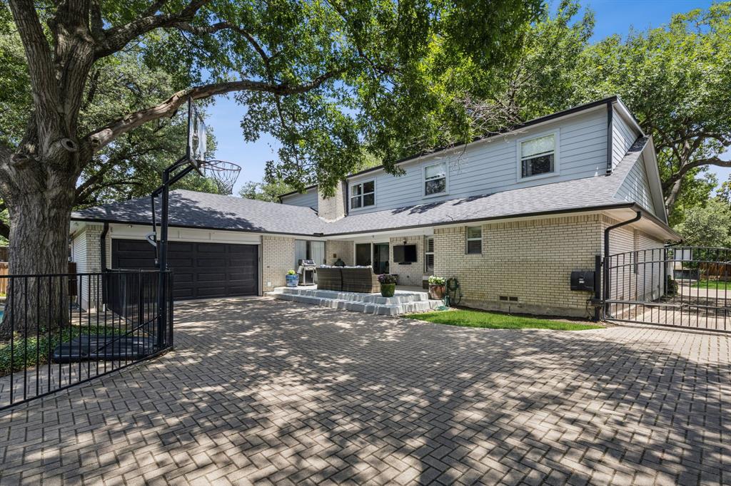 6222 East University Boulevard Dallas, TX 75214 - Photo 23 of 25 a view of a house with a yard and large tree