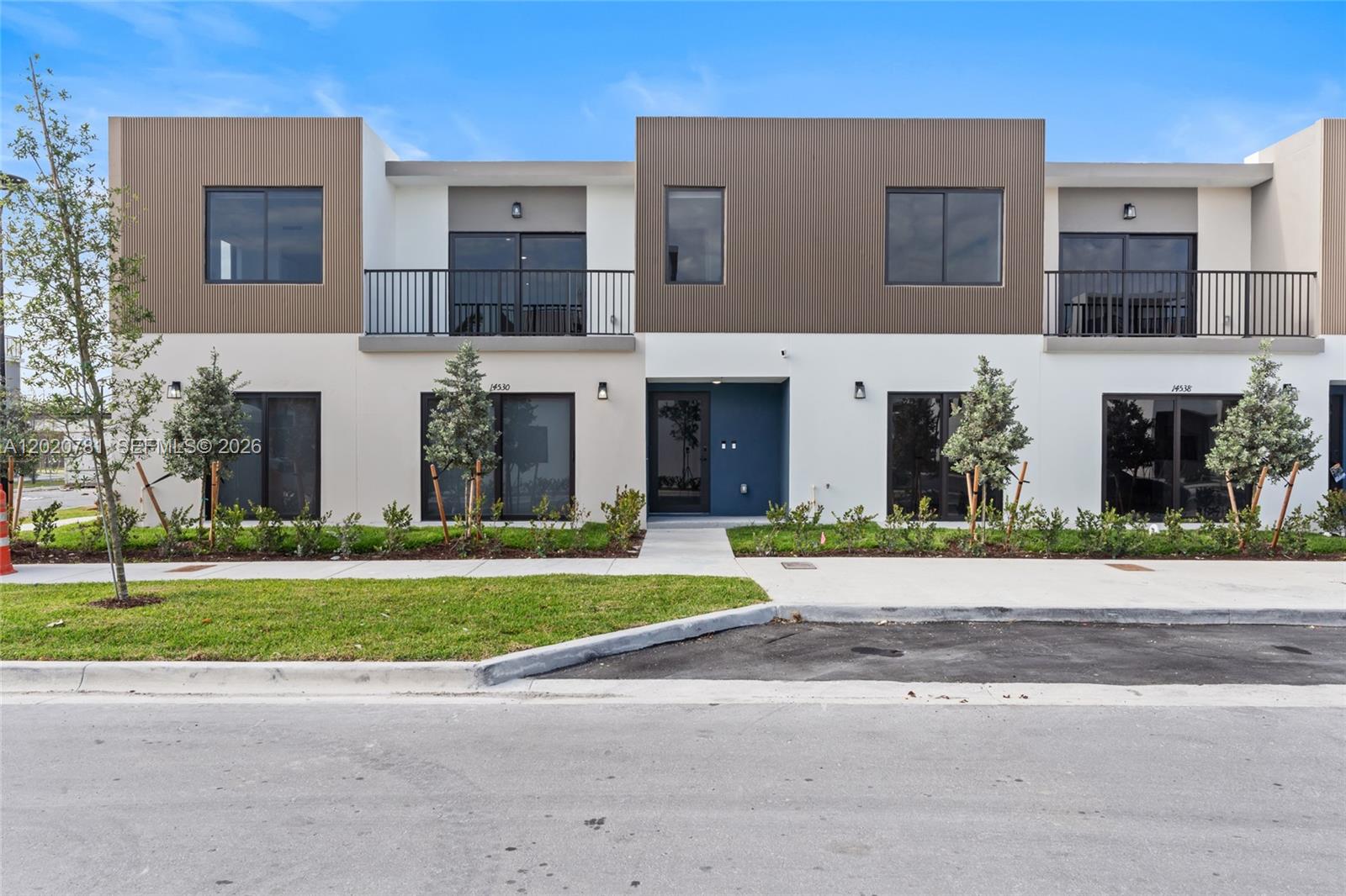 14530 Southwest 261st Terrace, Unit 2 Homestead, FL 33032 - Photo 17 of 23 front view of a brick house