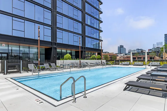 a view of a backyard with sitting area