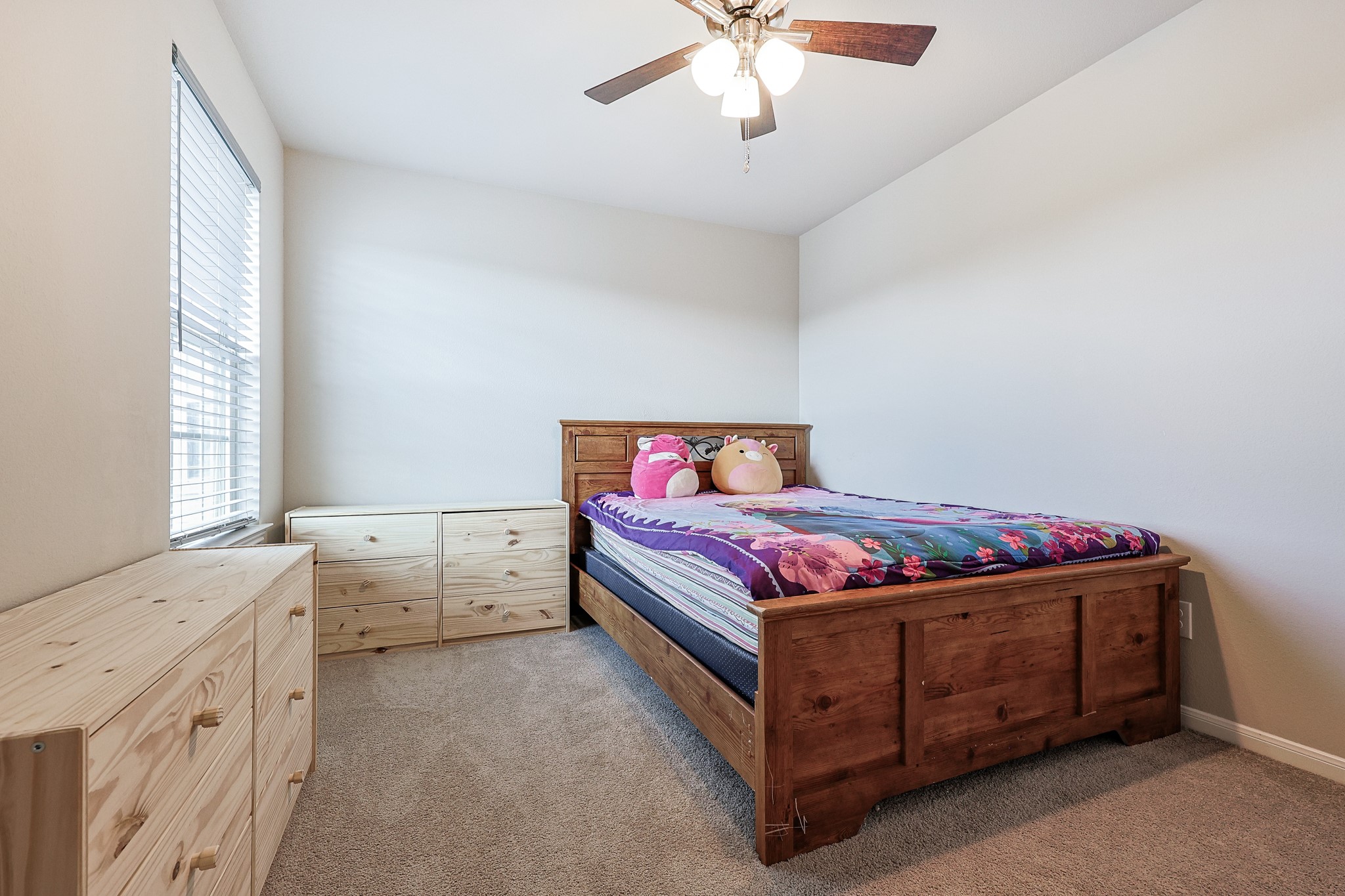 10423 Rochester Hls Lane Tomball, TX 77375 - Photo 28 of 36 This bedroom features cozy neutral carpeting and pristine white trim, making styling effortless.