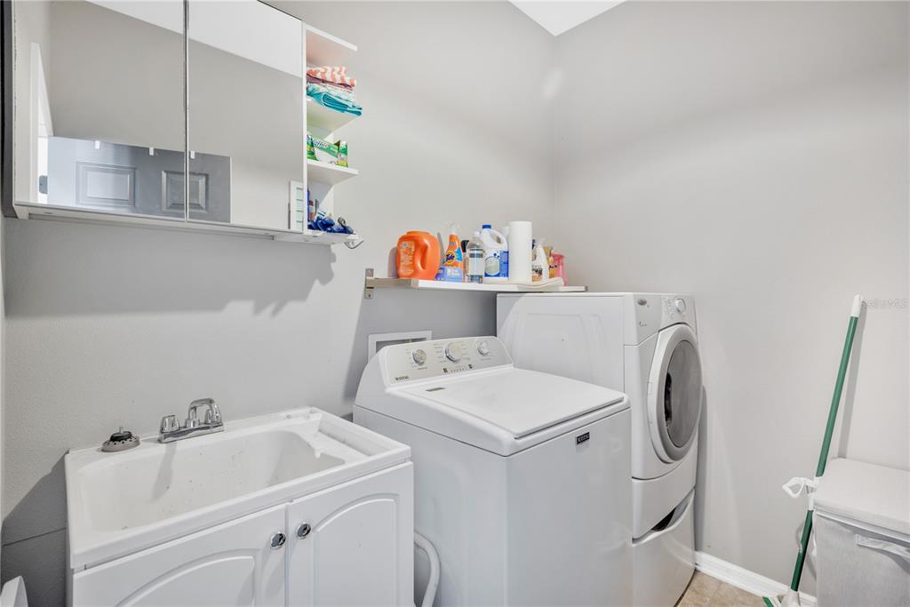 18345 Fish Loop Land O Lakes, FL 34638 - Photo 14 of 36 a utility room with dryer and washer