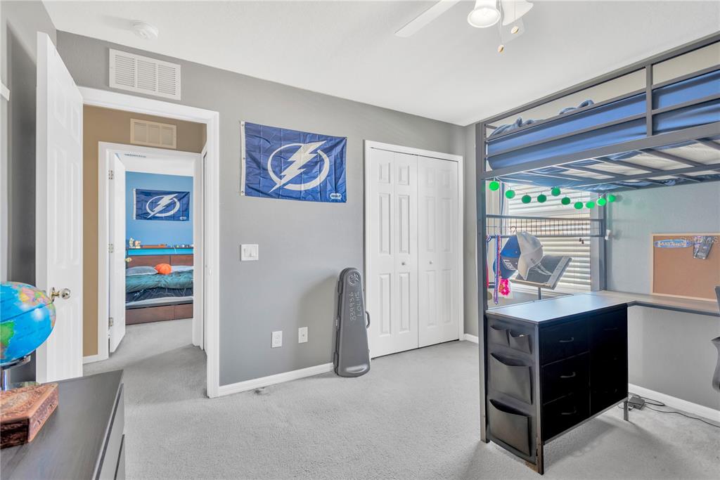 18345 Fish Loop Land O Lakes, FL 34638 - Photo 24 of 36 a room with furniture and window