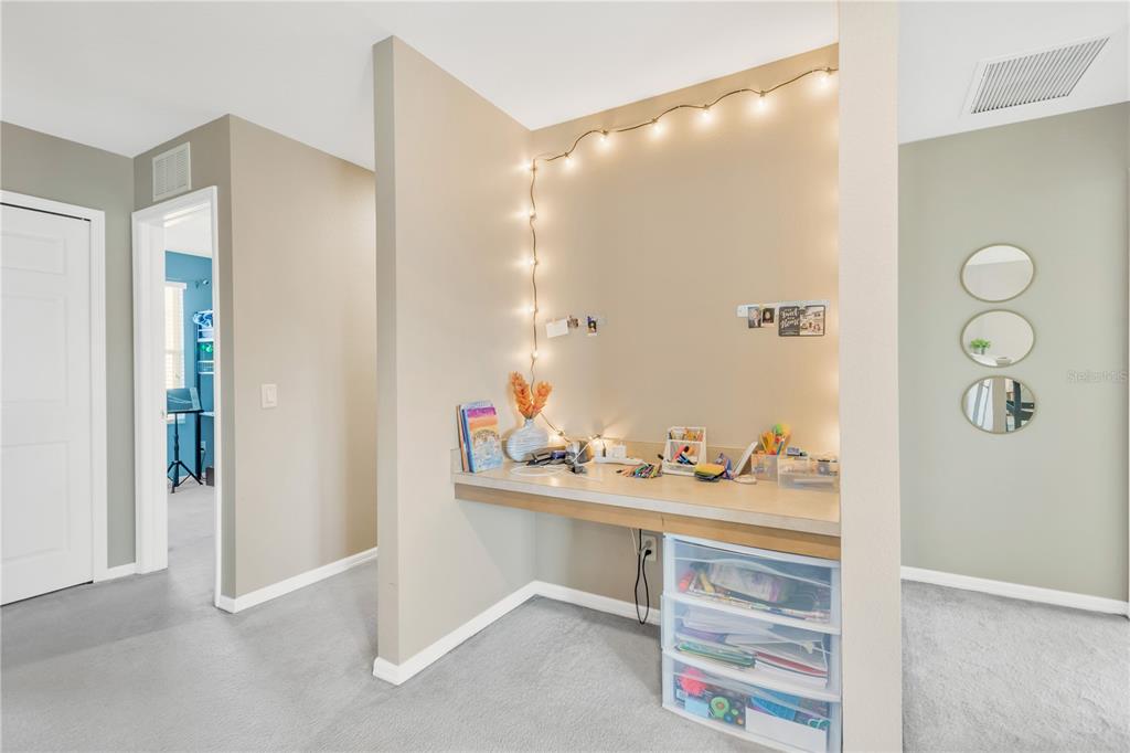 18345 Fish Loop Land O Lakes, FL 34638 - Photo 25 of 36 a bathroom with a sink and a mirror