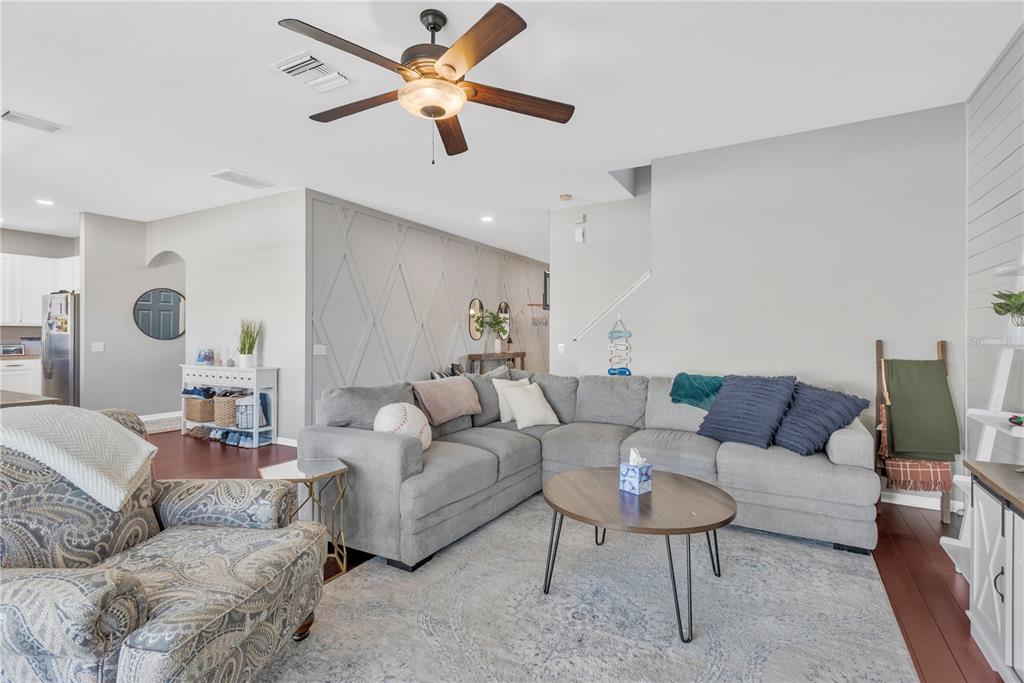 18345 Fish Loop Land O Lakes, FL 34638 - Photo 5 of 36 a living room with furniture and a large window