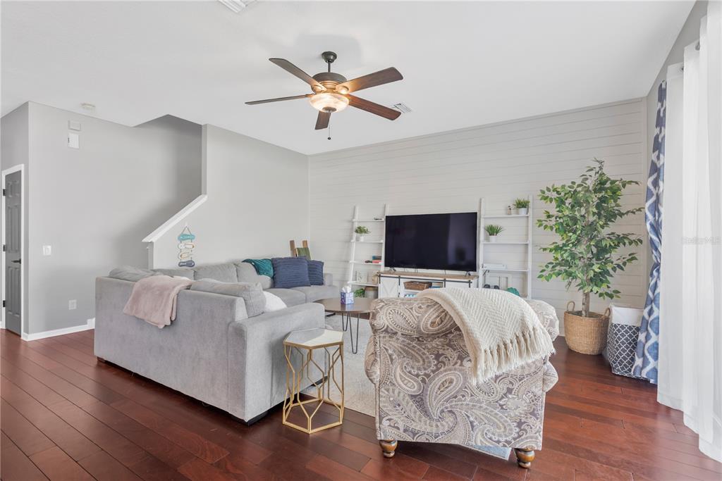 18345 Fish Loop Land O Lakes, FL 34638 - Photo 6 of 36 a living room with furniture and a flat screen tv