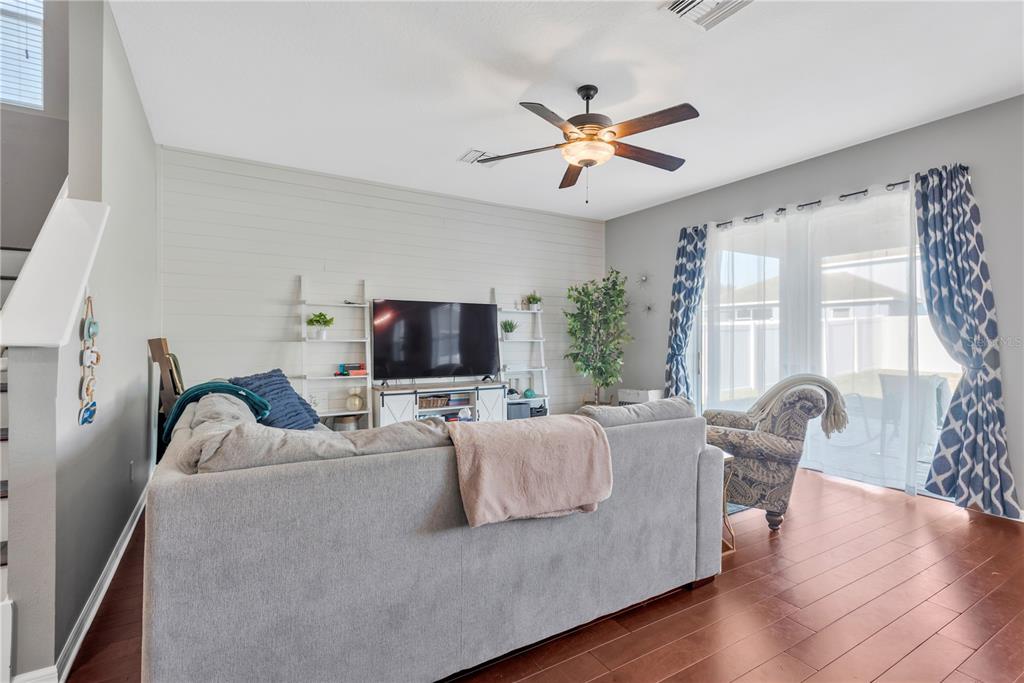 18345 Fish Loop Land O Lakes, FL 34638 - Photo 7 of 36 a living room with furniture and a flat screen tv