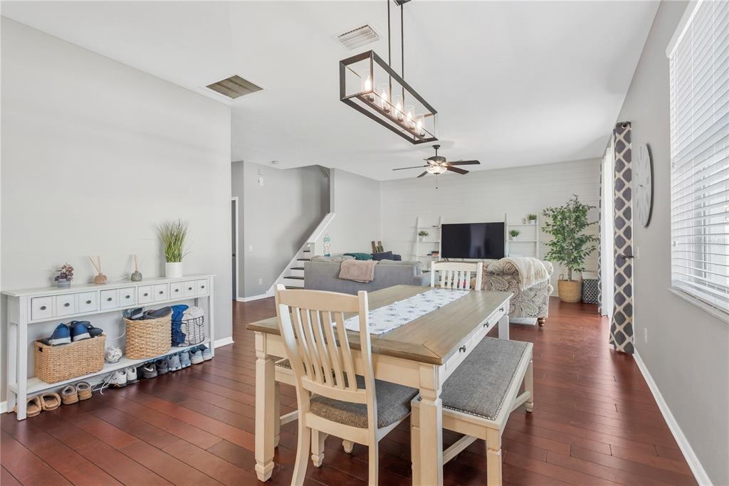 18345 Fish Loop Land O Lakes, FL 34638 - Photo 9 of 36 a view of a dining room with furniture window and wooden floor