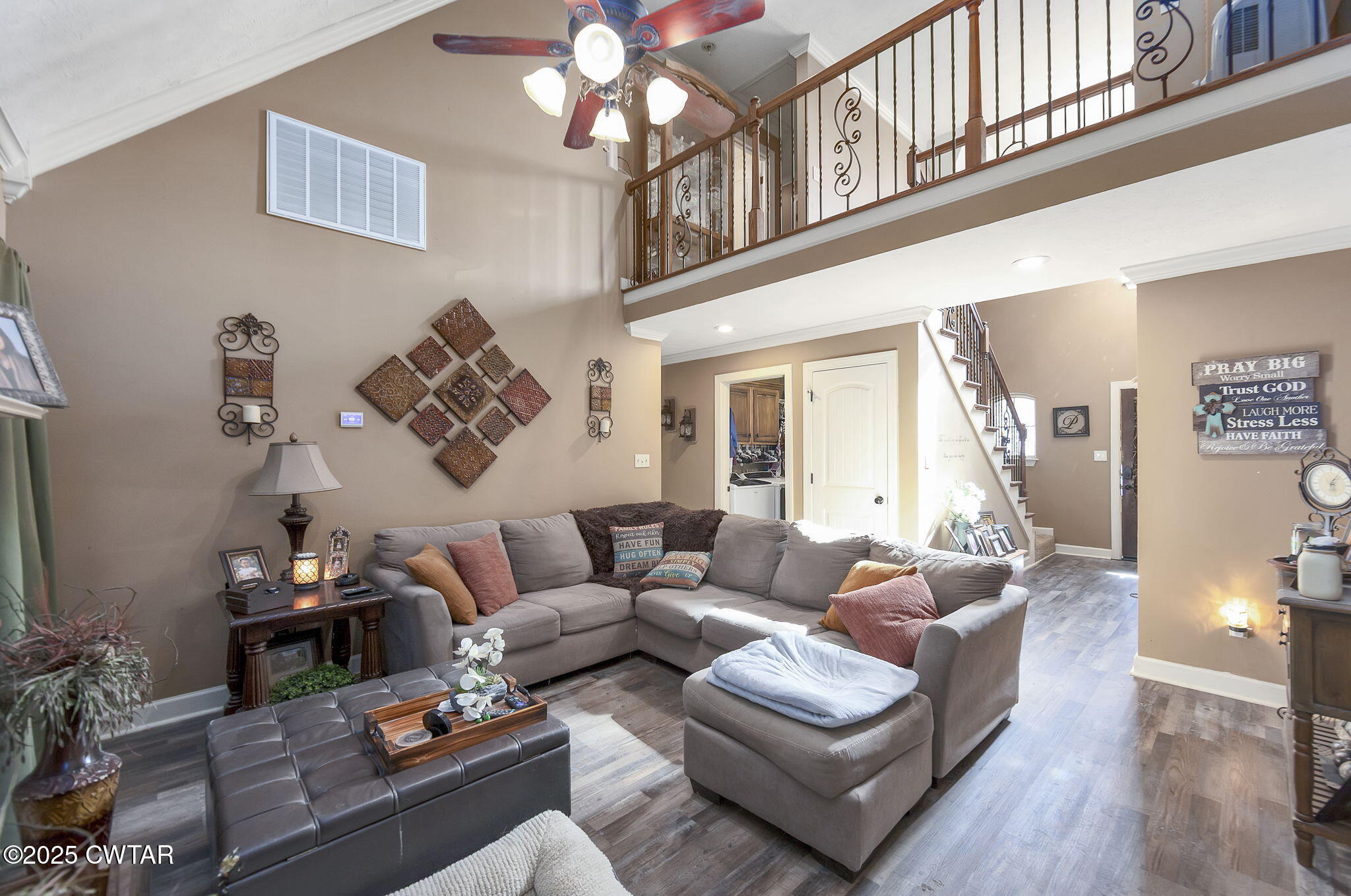 226 Fawn Ridge Lane Medina, TN 38355 - Photo 11 of 22 a living room with furniture a rug and a chandelier