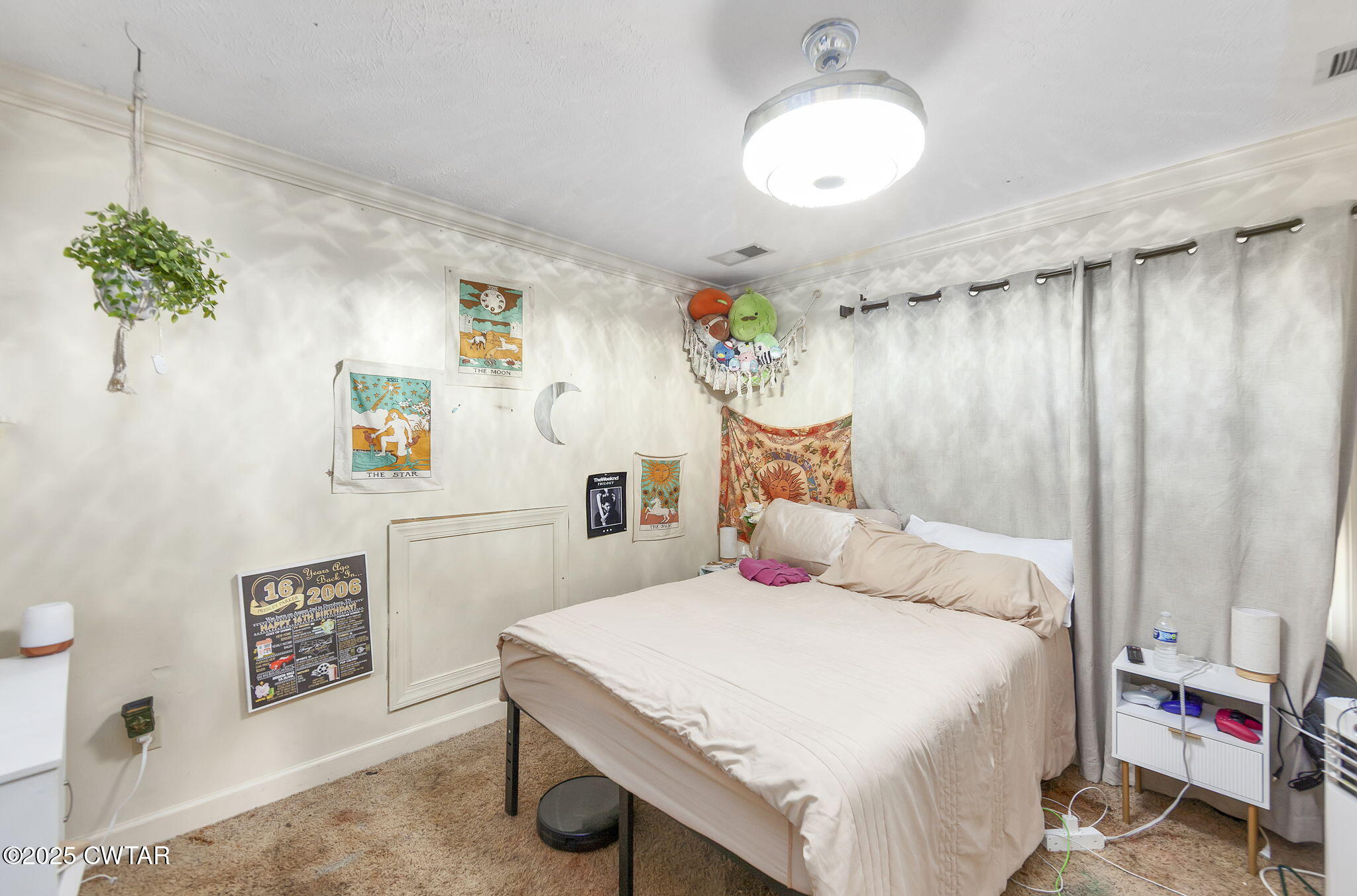 226 Fawn Ridge Lane Medina, TN 38355 - Photo 18 of 22 a bedroom with a bed and a chandelier