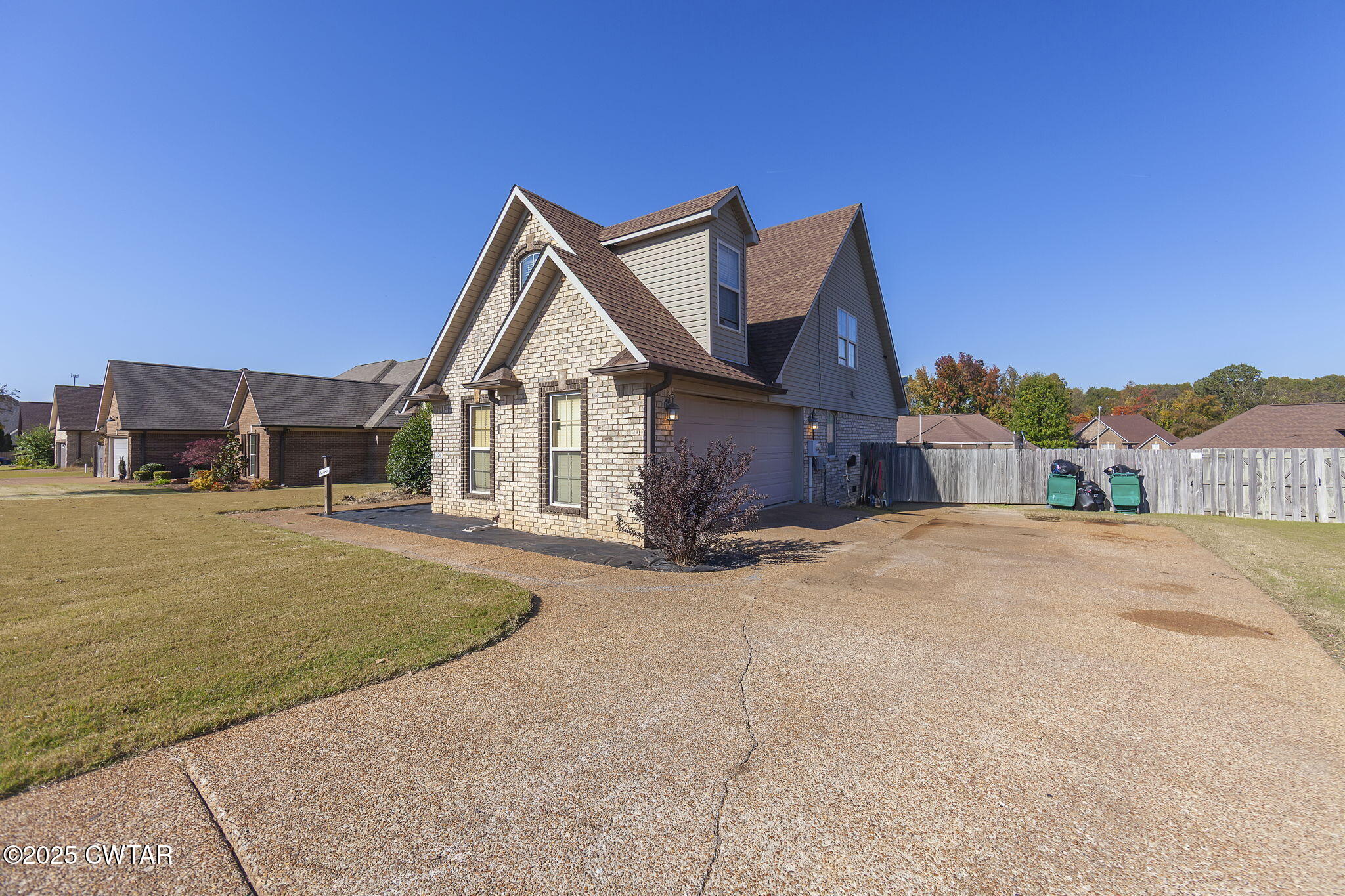 226 Fawn Ridge Lane Medina, TN 38355 - Photo 2 of 22 a front view of a house with a yard and garage