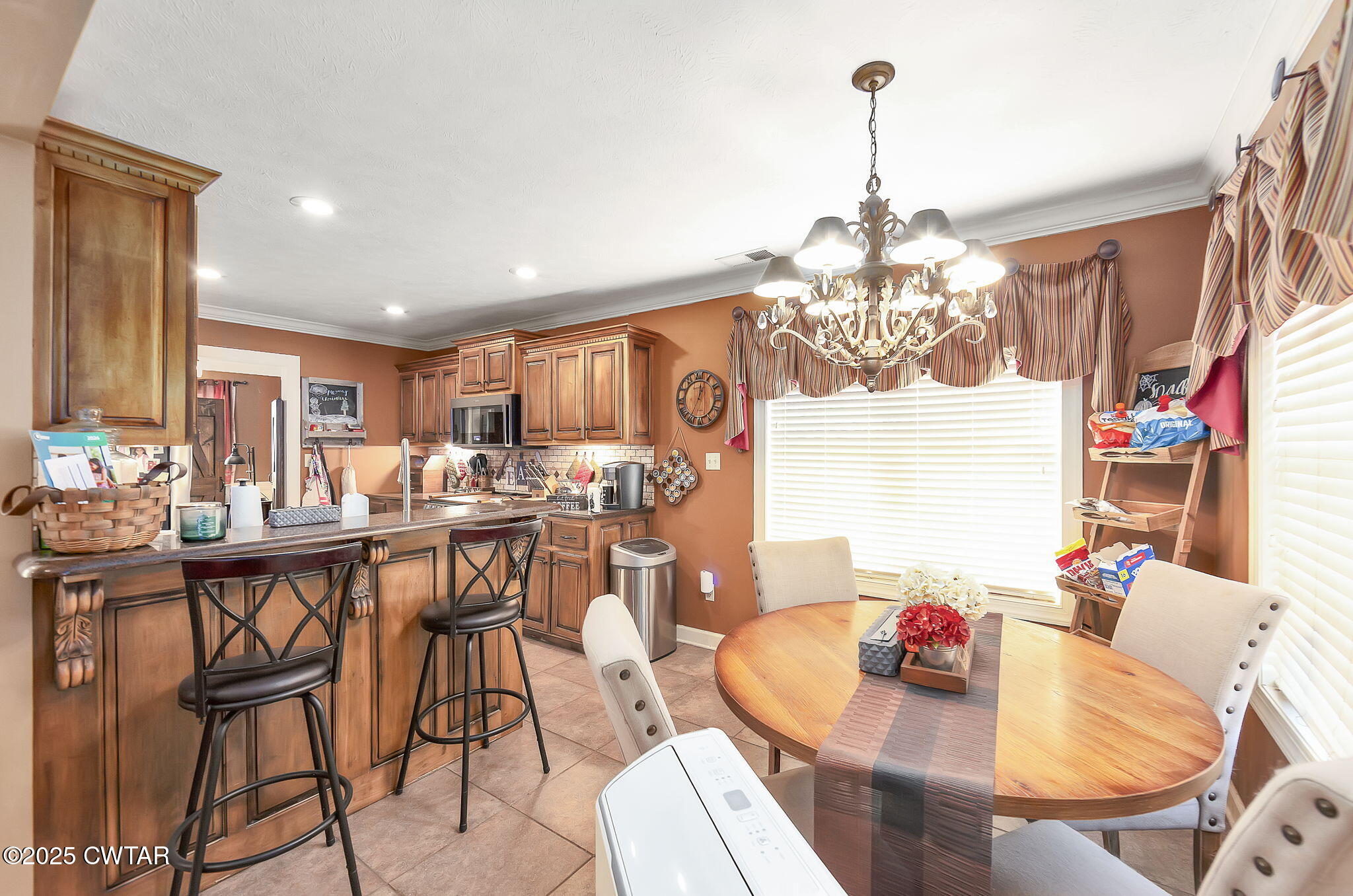 226 Fawn Ridge Lane Medina, TN 38355 - Photo 7 of 22 a dining room filled chandelier and wooden furniture