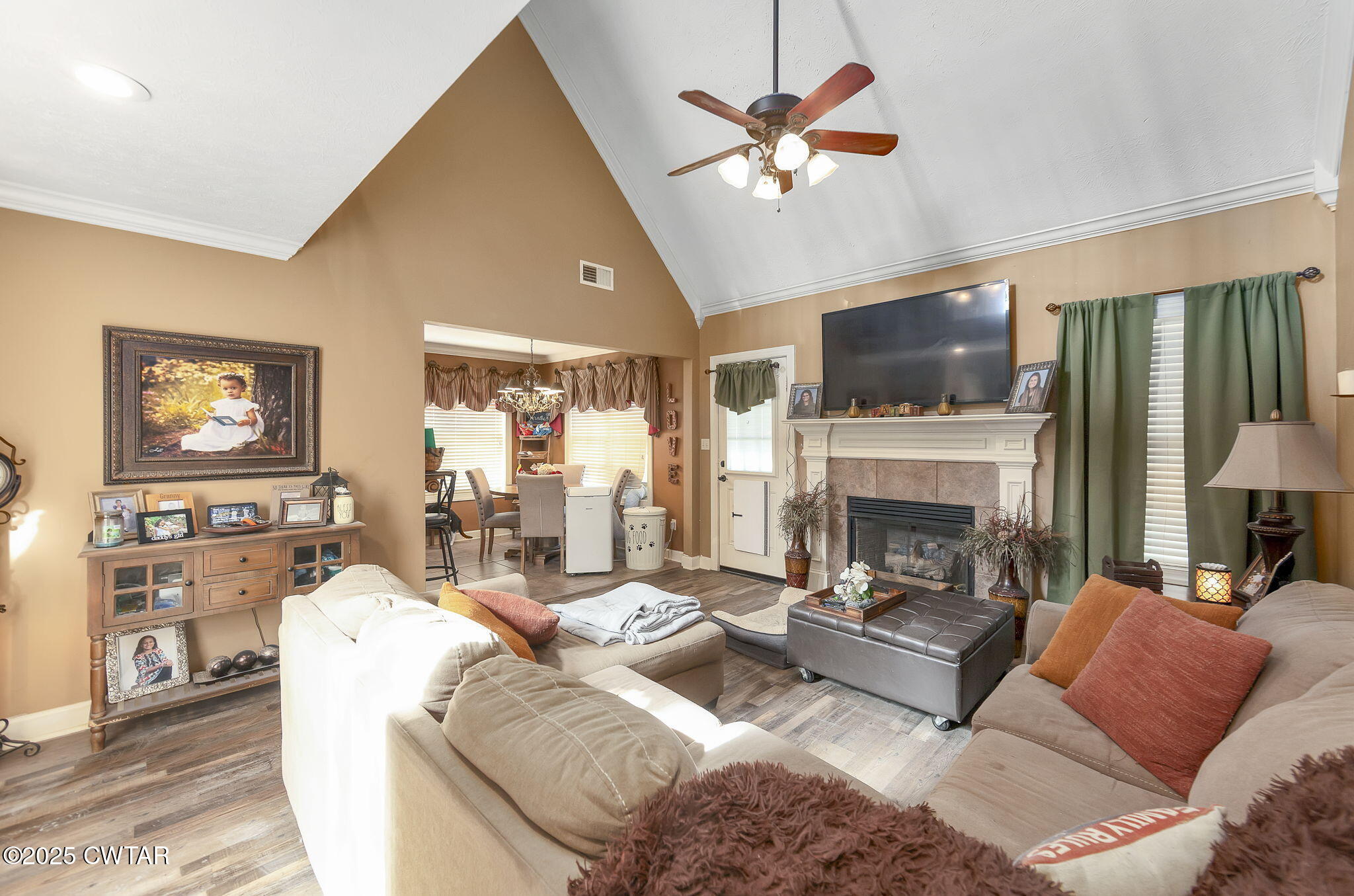 226 Fawn Ridge Lane Medina, TN 38355 - Photo 9 of 22 a living room with furniture a fireplace and a flat screen tv
