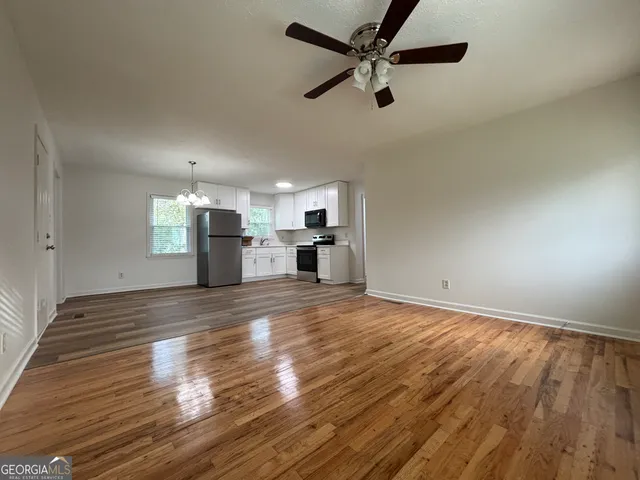 a kitchen with a refrigerator stove and microwave
