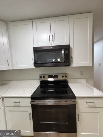a bathroom with a sink and a window