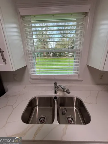 a white refrigerator freezer sitting in a kitchen