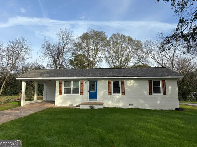 front view of a house with a yard