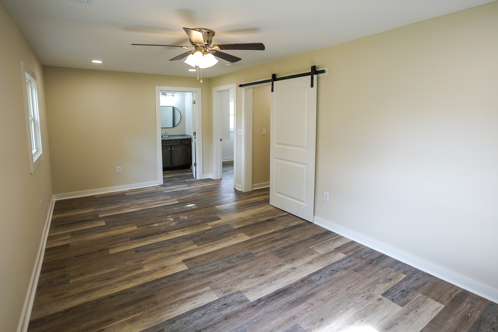 1080 Manley Loop Dickson, TN 37055 - Photo 24 of 42 a view of empty room with wooden floor and fan