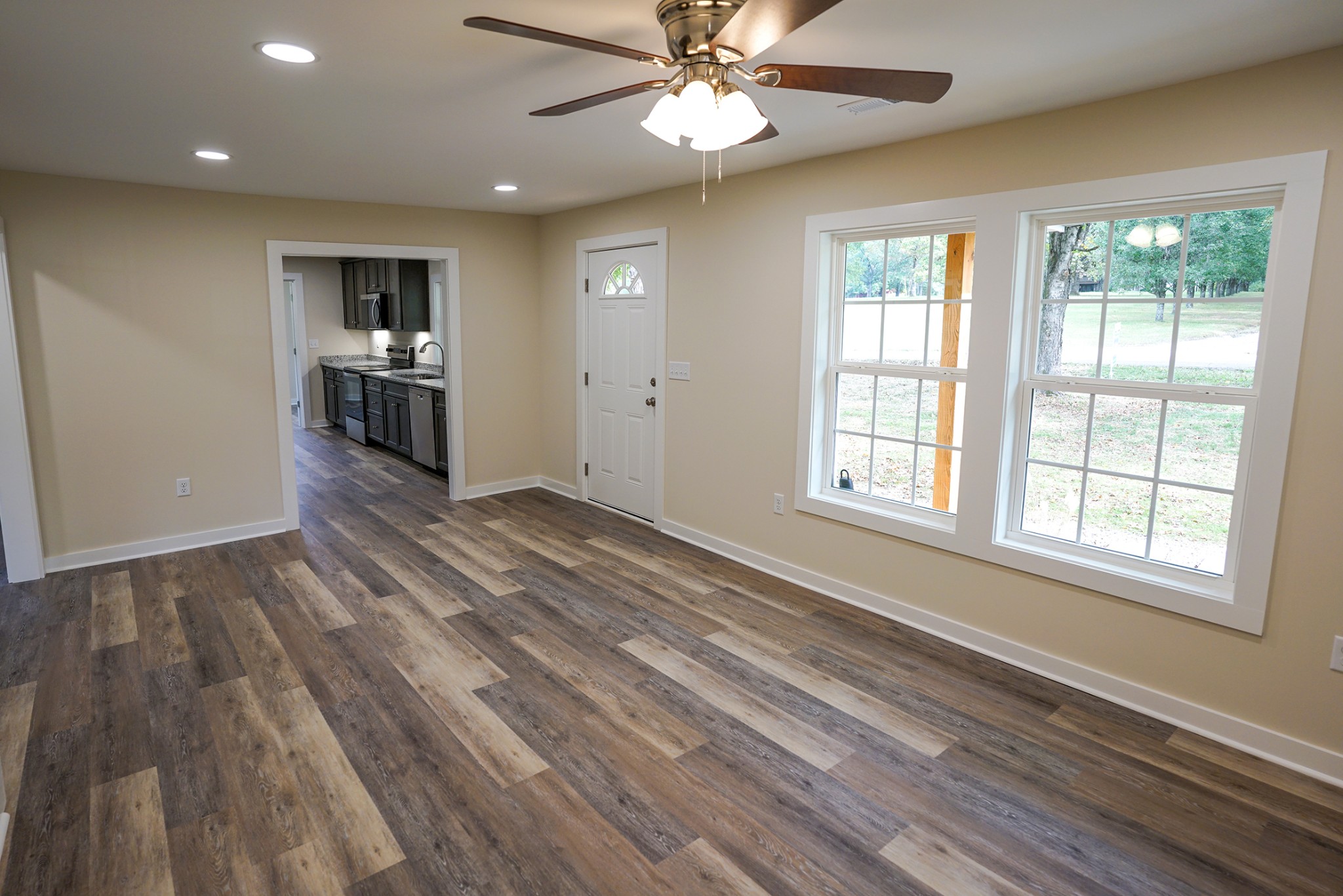 1080 Manley Loop Dickson, TN 37055 - Photo 35 of 42 a view of an empty room with window and wooden floor