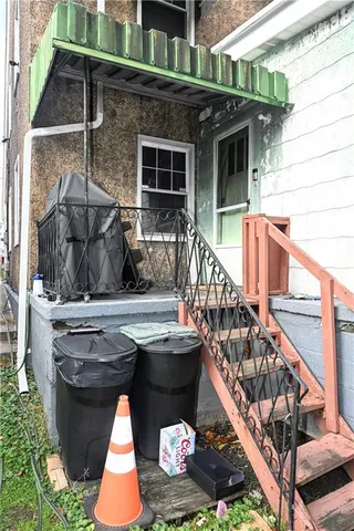 a view of balcony with table and chairs