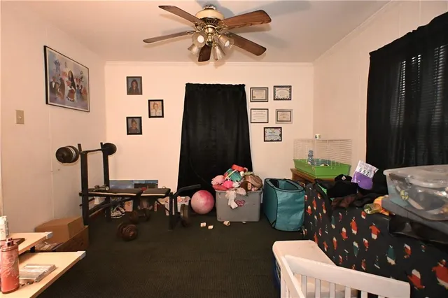 a bedroom with a bed and furniture