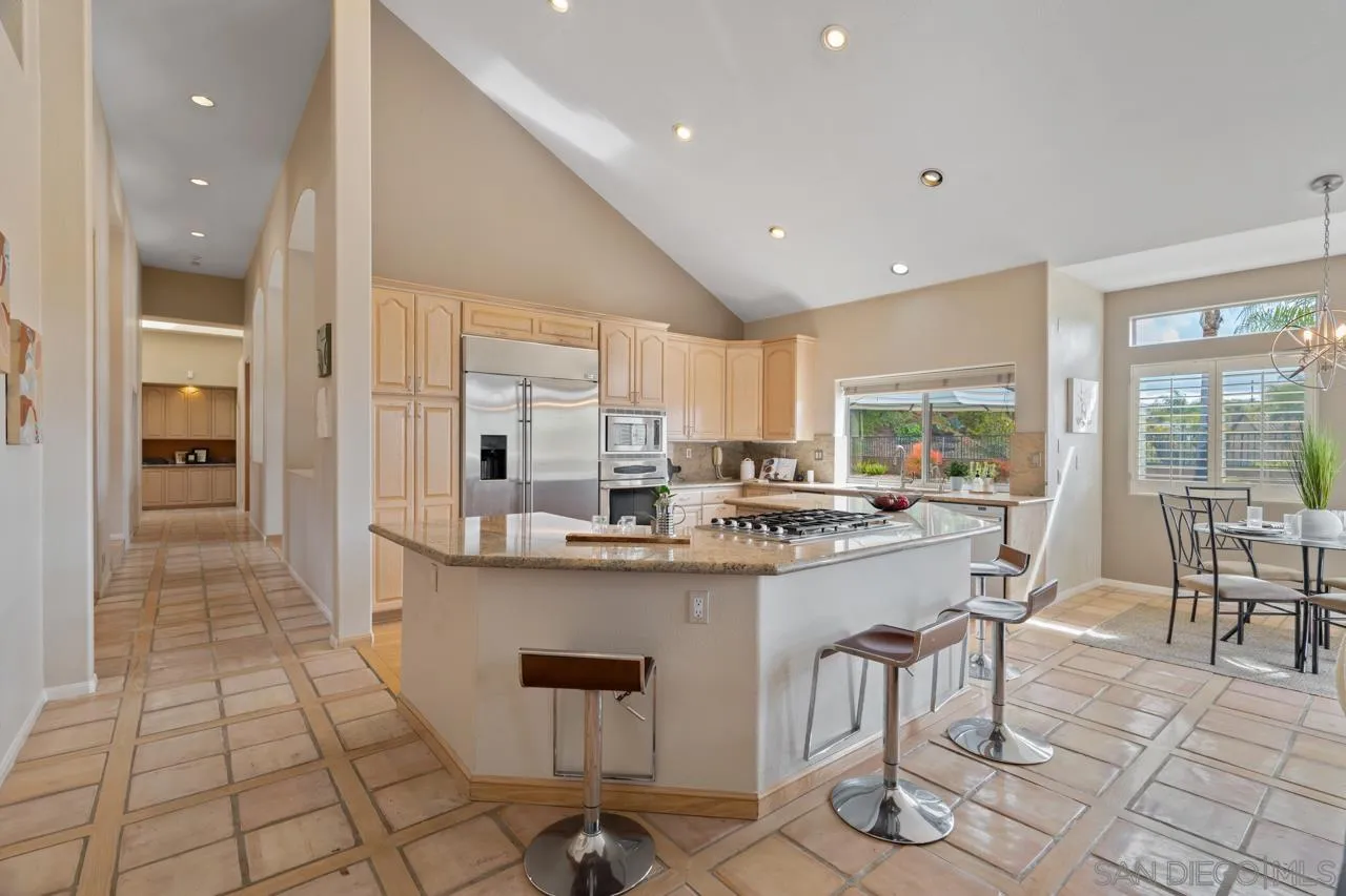 12245 Malabar Drive Poway, CA 92064 - Photo 16 of 43 a kitchen with stainless steel appliances granite countertop a sink and cabinets