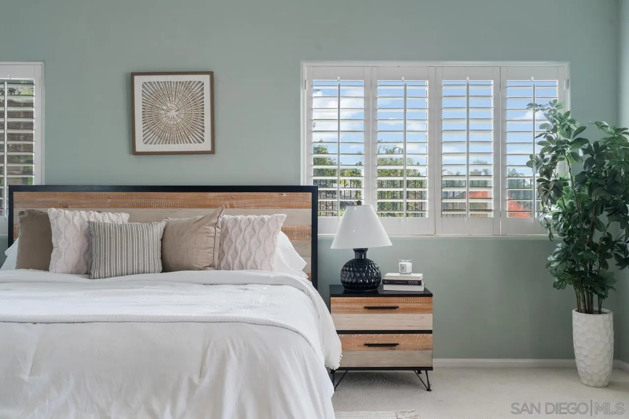 12245 Malabar Drive Poway, CA 92064 - Photo 26 of 43 a bedroom with a bed and a potted plant